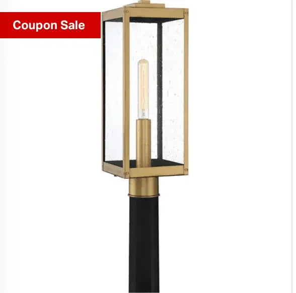 Modern outdoor post lantern with clear glass and gold metal frame, on coupon sale.